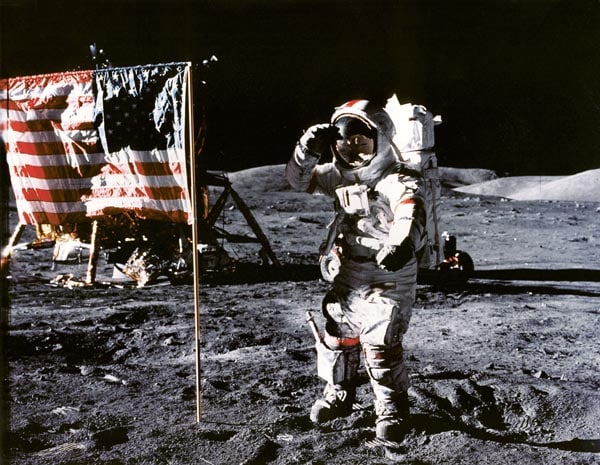 Eugene Cernan on the Moon next to the American flag