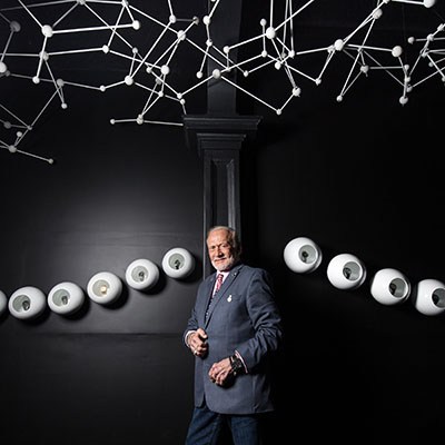 Buzz Aldrin posing at Omega House in Rio under constellations